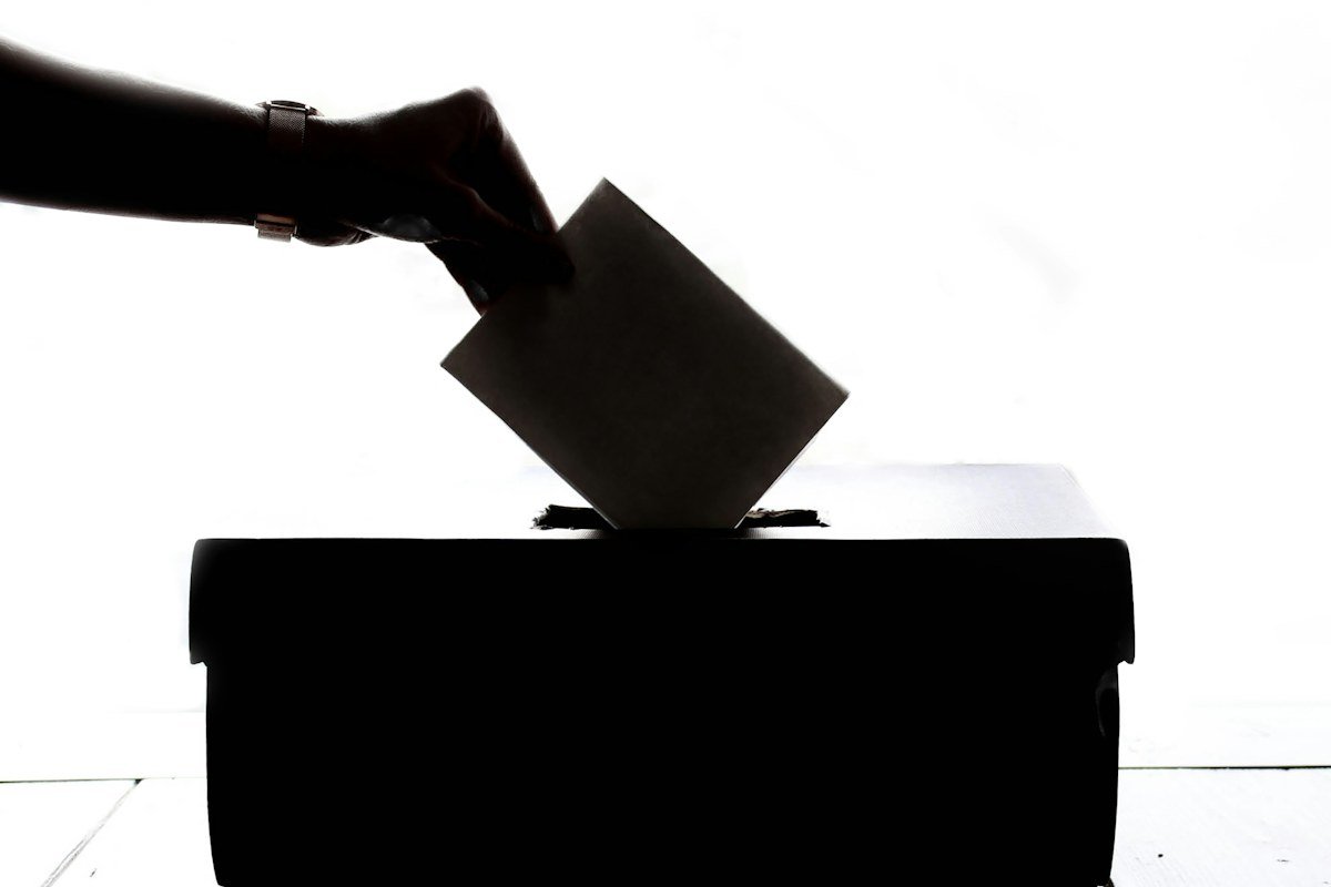 Illustrative ballot being cast, not an official Pennsylvania mail ballot