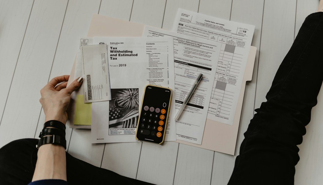 Calculator and paperwork used to plan payments